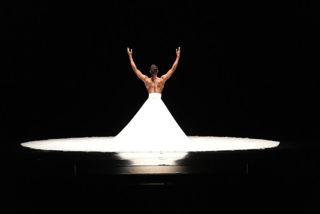 Zsilas Michael Hughes, dressed in a beautiful, white gown, (PNB Dancer) performs "The Calling."